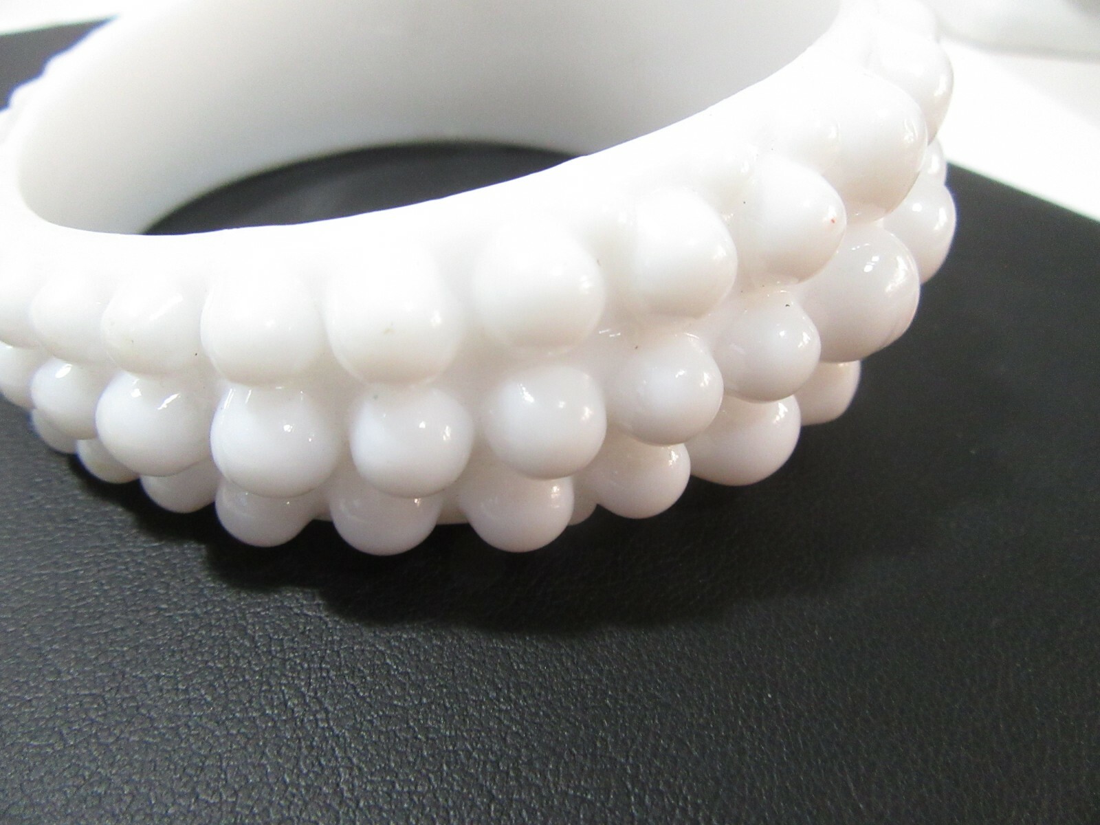 VERY LARGE WHITE ‘BEADED’ BANGLE BRACELET ODD MORPHED HIGHER ON ONE SIDE