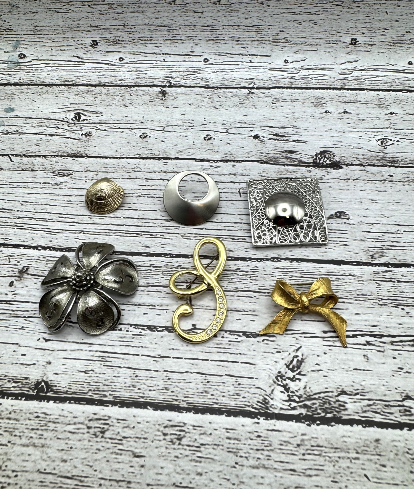 Lot of 6 Silver Tone and Gold Tone Metal Brooches Flower, Bow, Seashell, etc.