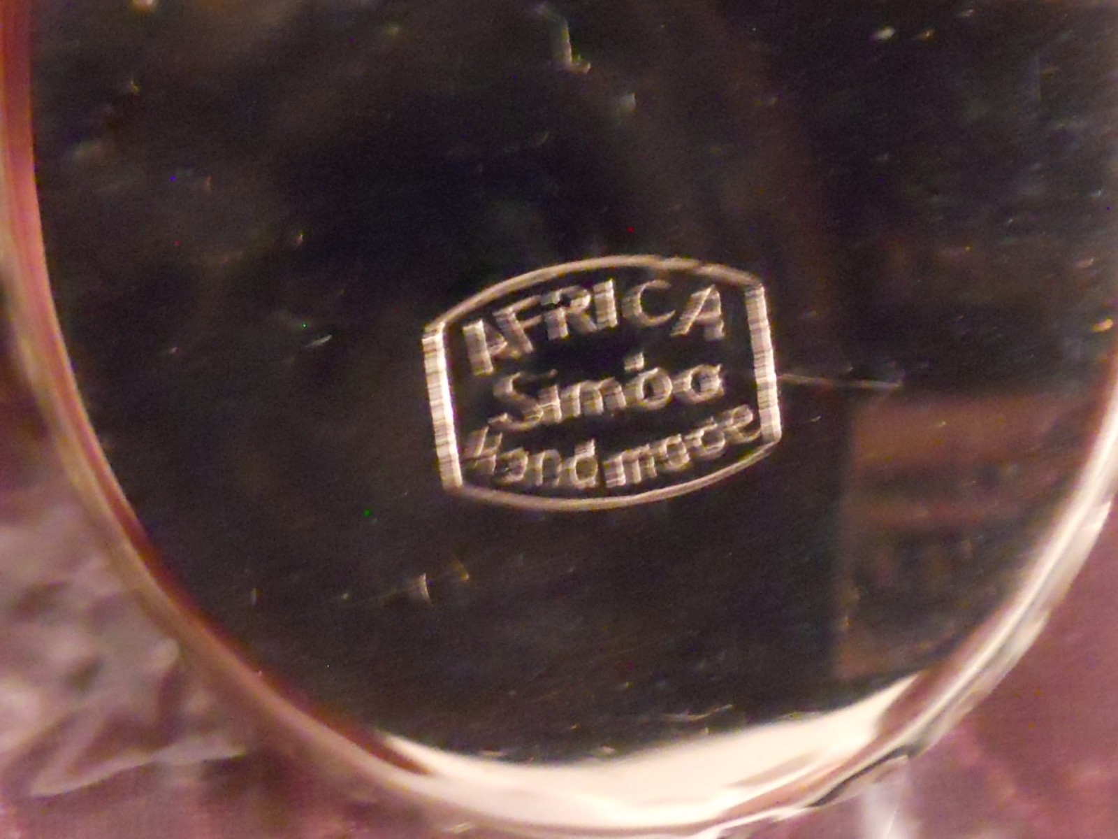 VINTAGE AFRICAN MOUNTED SIGNED SIMBA BURNT SILVER METAL CIRCLE BROOCH