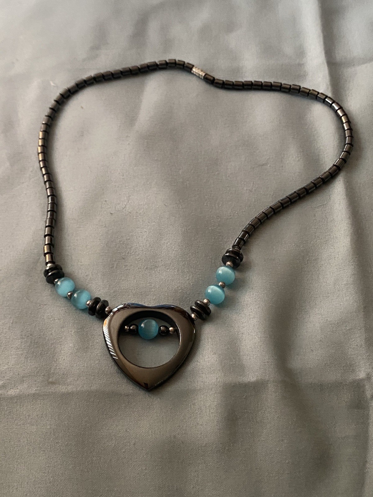 16” Hematite Necklace Heart Pendant 1.25” H Aqua Blue Cat’s Eye Beads Celestial