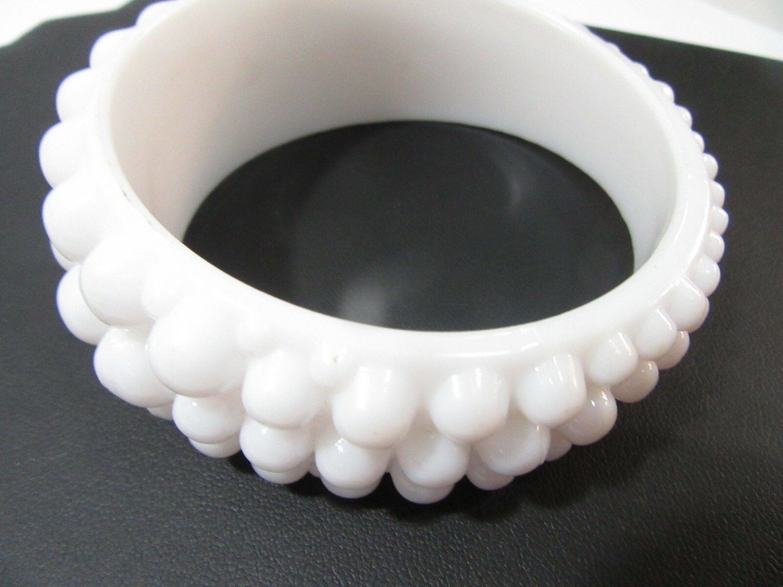 VERY LARGE WHITE ‘BEADED’ BANGLE BRACELET ODD MORPHED HIGHER ON ONE SIDE