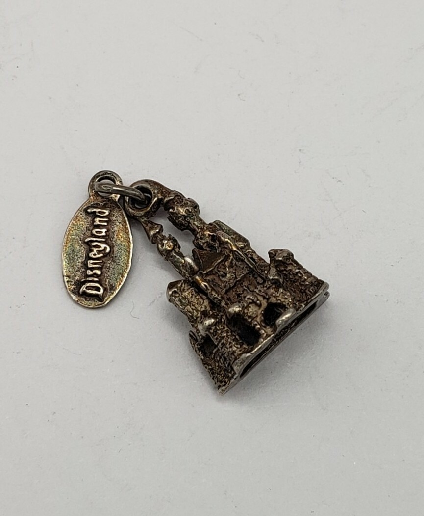 VINTAGE WALT DISNEY PRODUCTIONS STERLING SILVER DISNEY LAND CHARM