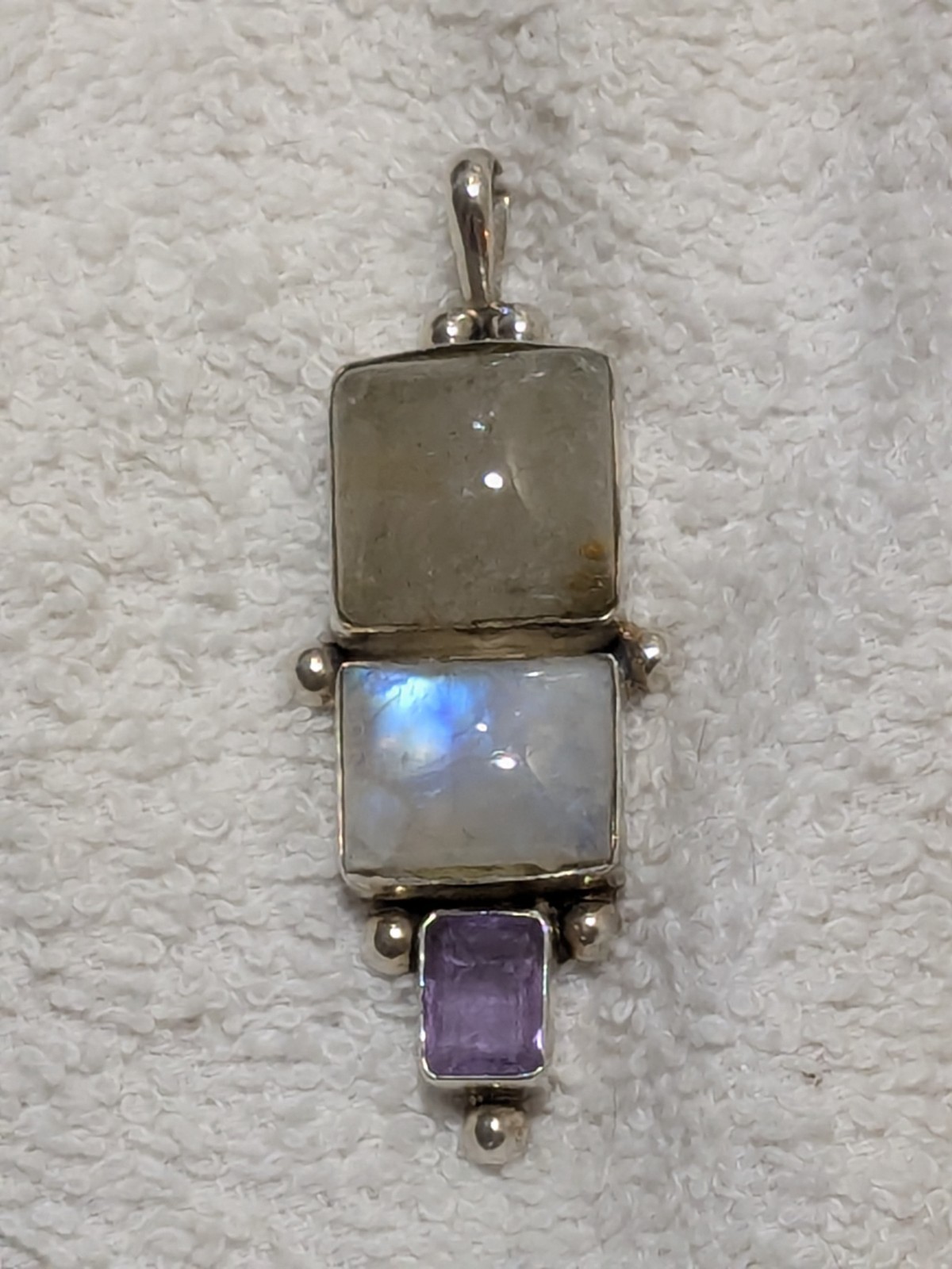Vintage Sterling silver pendant featuring moonstone and amethyst gemstones