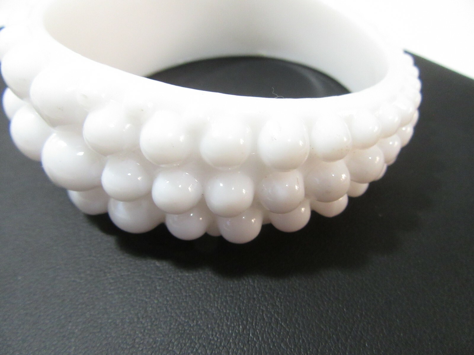 VERY LARGE WHITE ‘BEADED’ BANGLE BRACELET ODD MORPHED HIGHER ON ONE SIDE