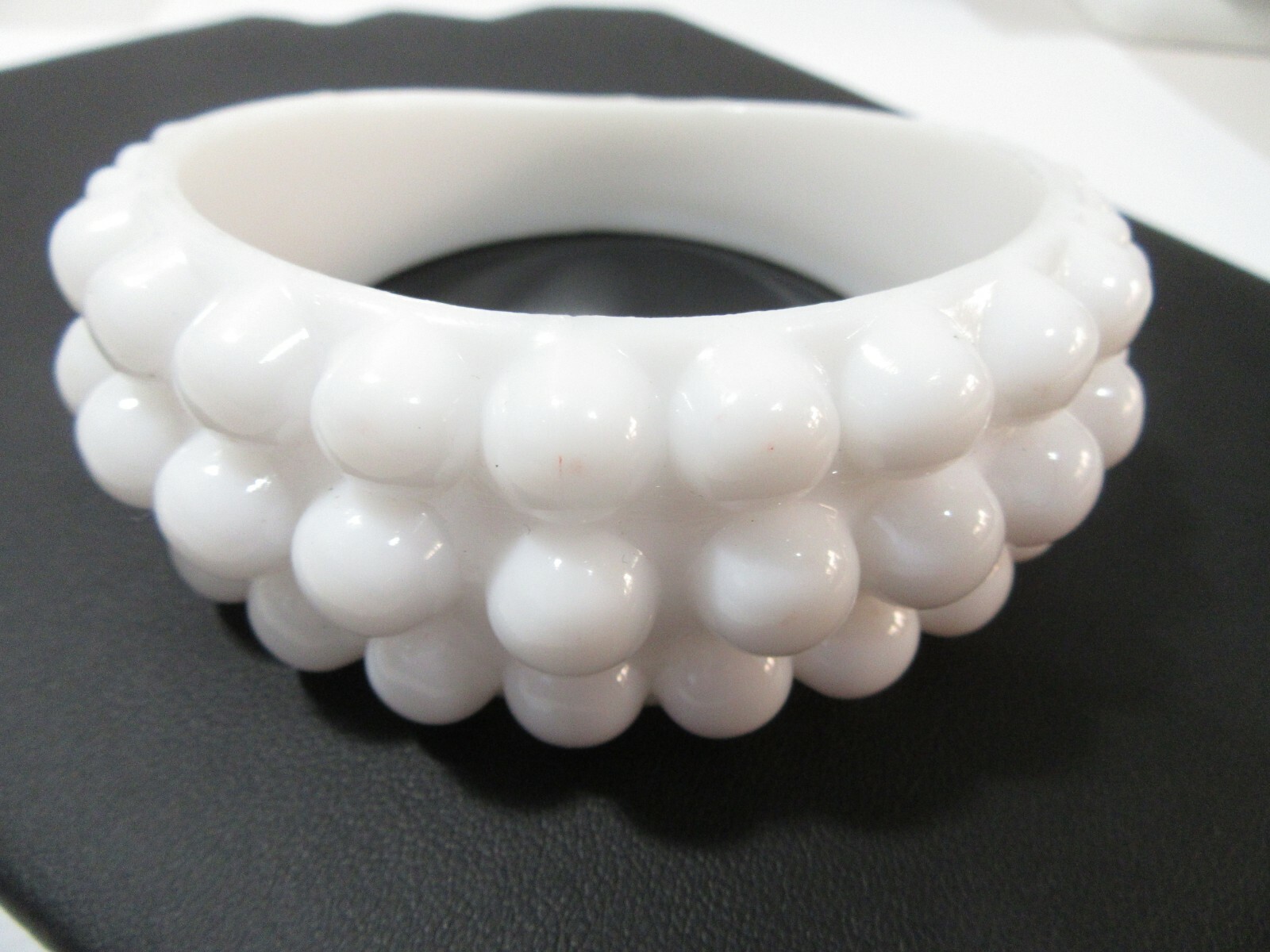 VERY LARGE WHITE ‘BEADED’ BANGLE BRACELET ODD MORPHED HIGHER ON ONE SIDE
